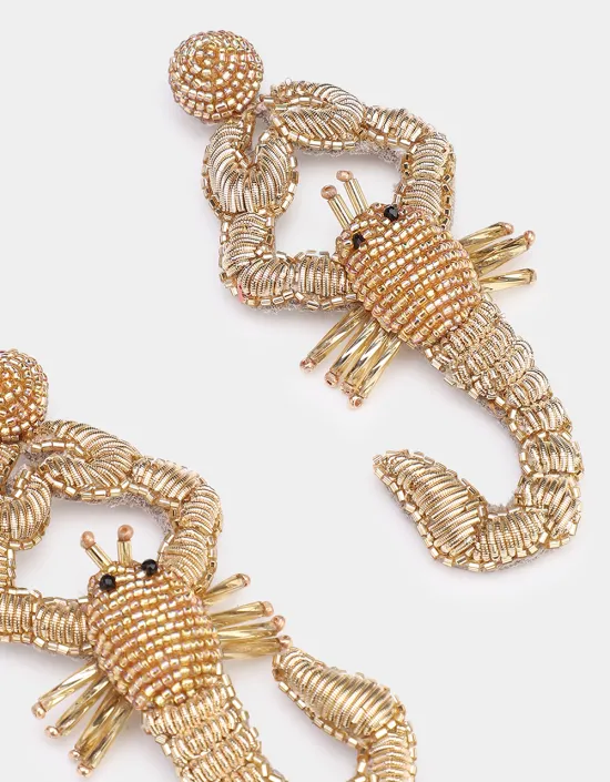scorpio-earrings-gold-détails.webp