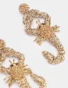 scorpio-earrings-gold-détails.webp